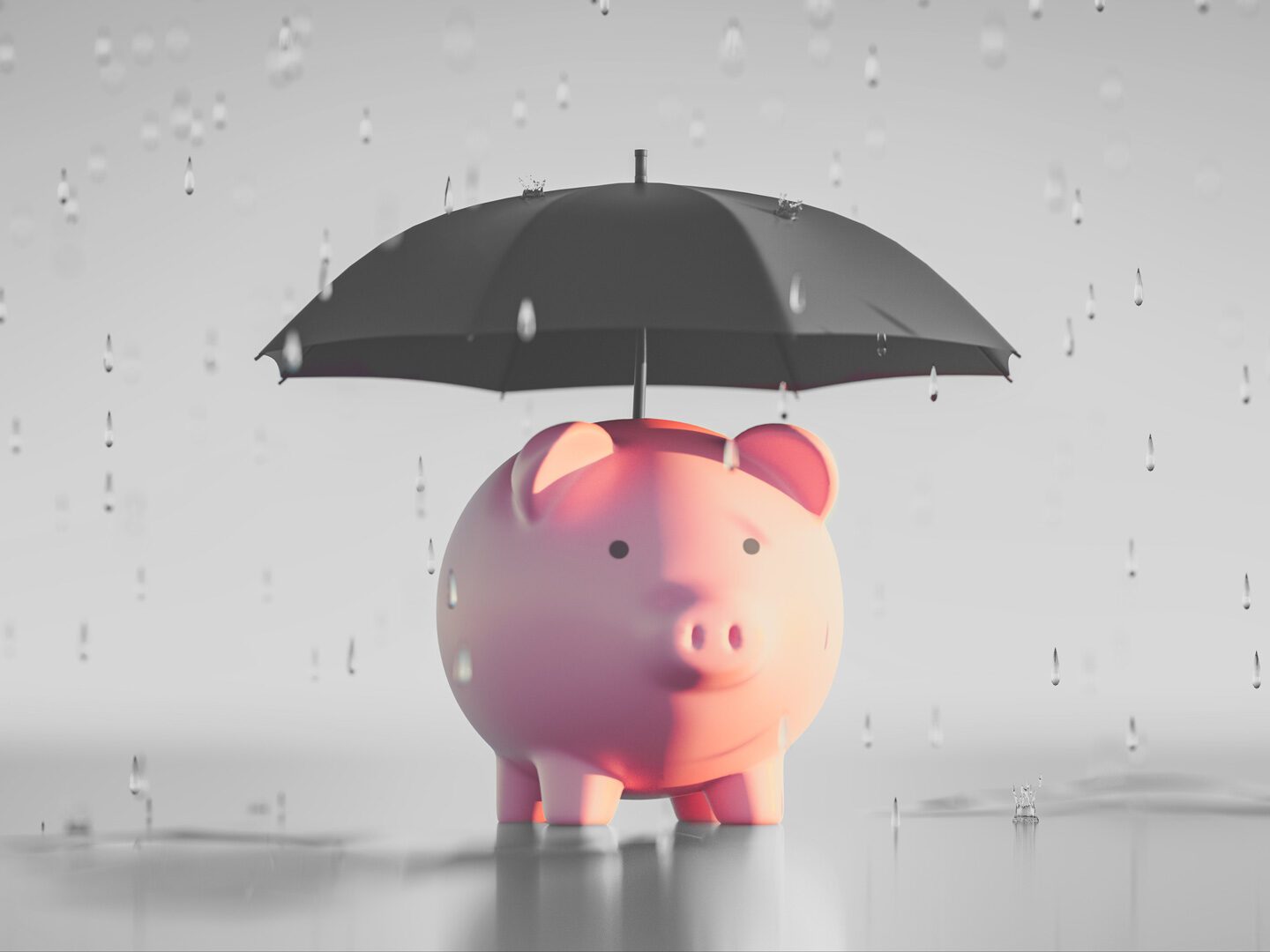Ein Sparschwein mit Regenschirm.